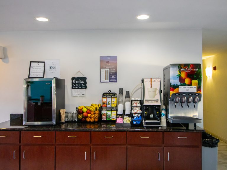 Complimentary breakfast area with coffee, juice and fruit